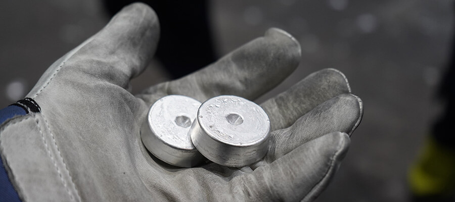 Hand holding aluminum samples